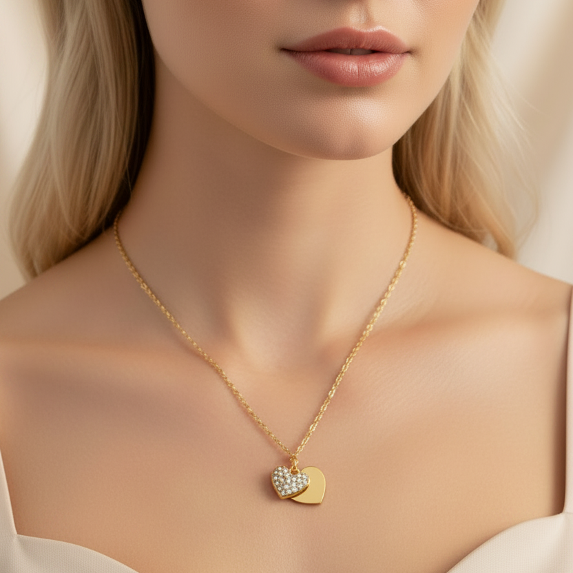 Woman wearing a gold necklace with a heart-shaped pendant 