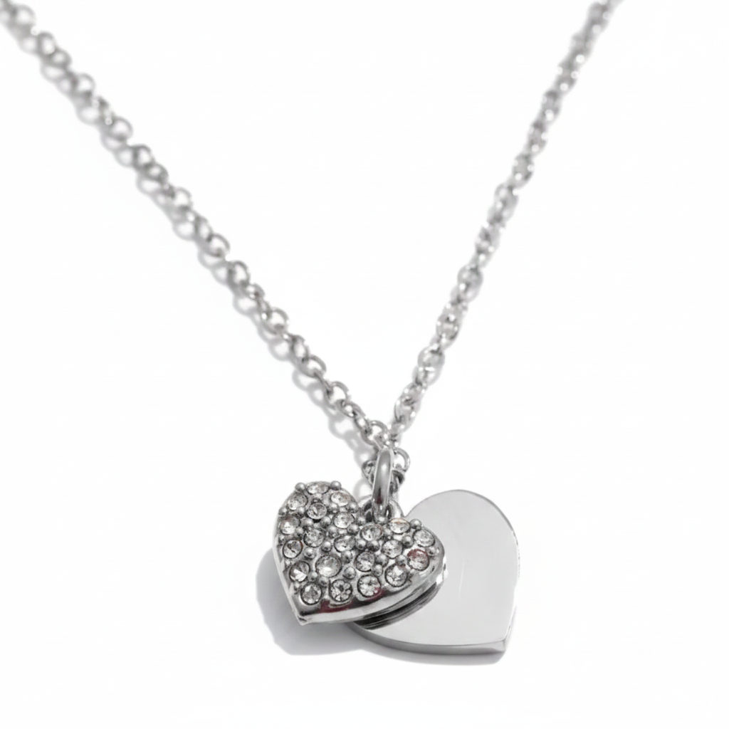 Silver heart-shaped charm necklace with embedded cubic zirconia